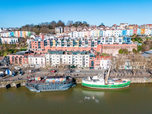 Colorful houses overlooking bristol harbor scene