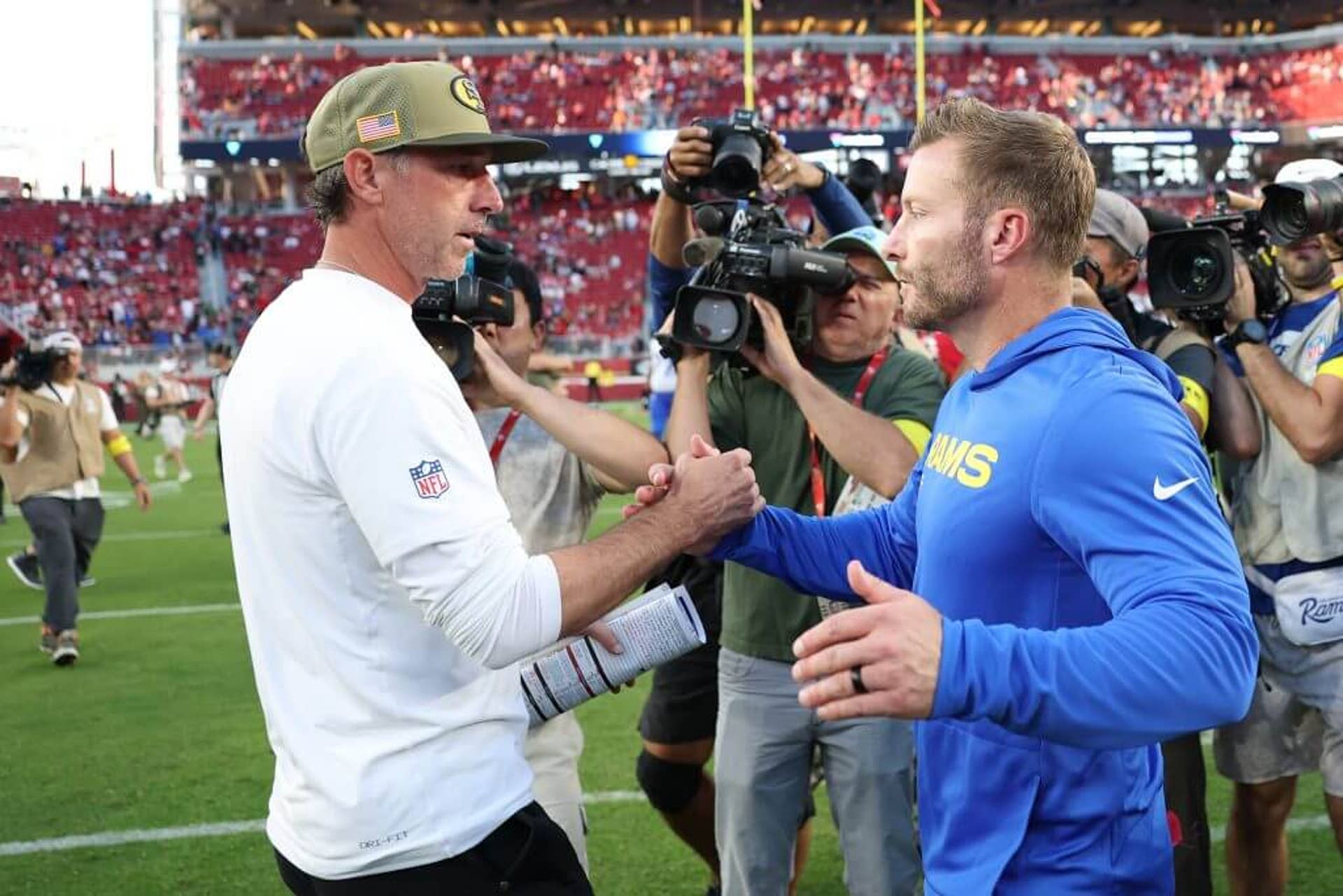 Head coach Kyle Shanahan of the San Francisco 49ers, left, and head coach Sean McVay of the Los Angeles Rams shake hands after a game.