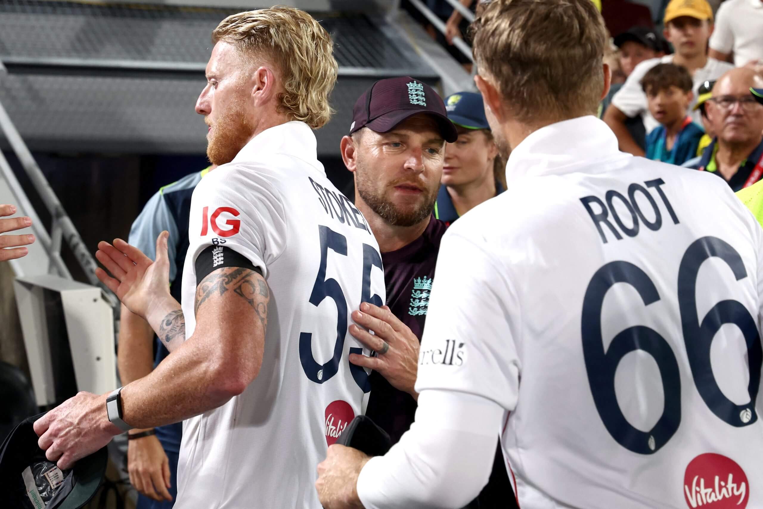 Brendon McCullum shakes hands with Ben Stokes and Joe Root at the close of play in Brisbane in December