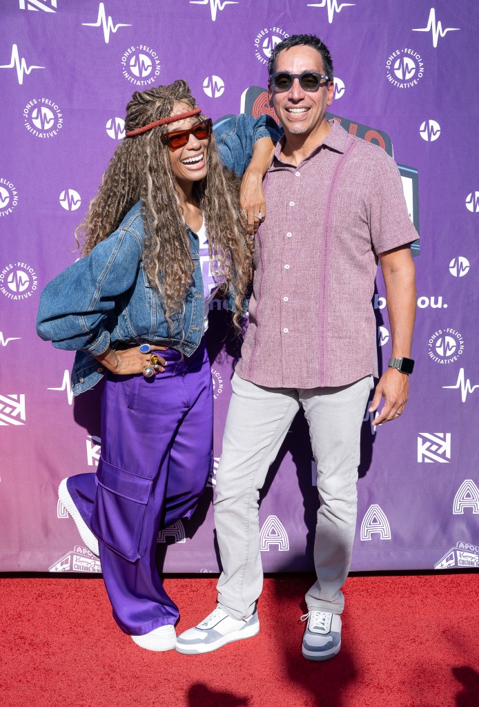 Kwanza Jones and José E. Feliciano attend a red carpet event.