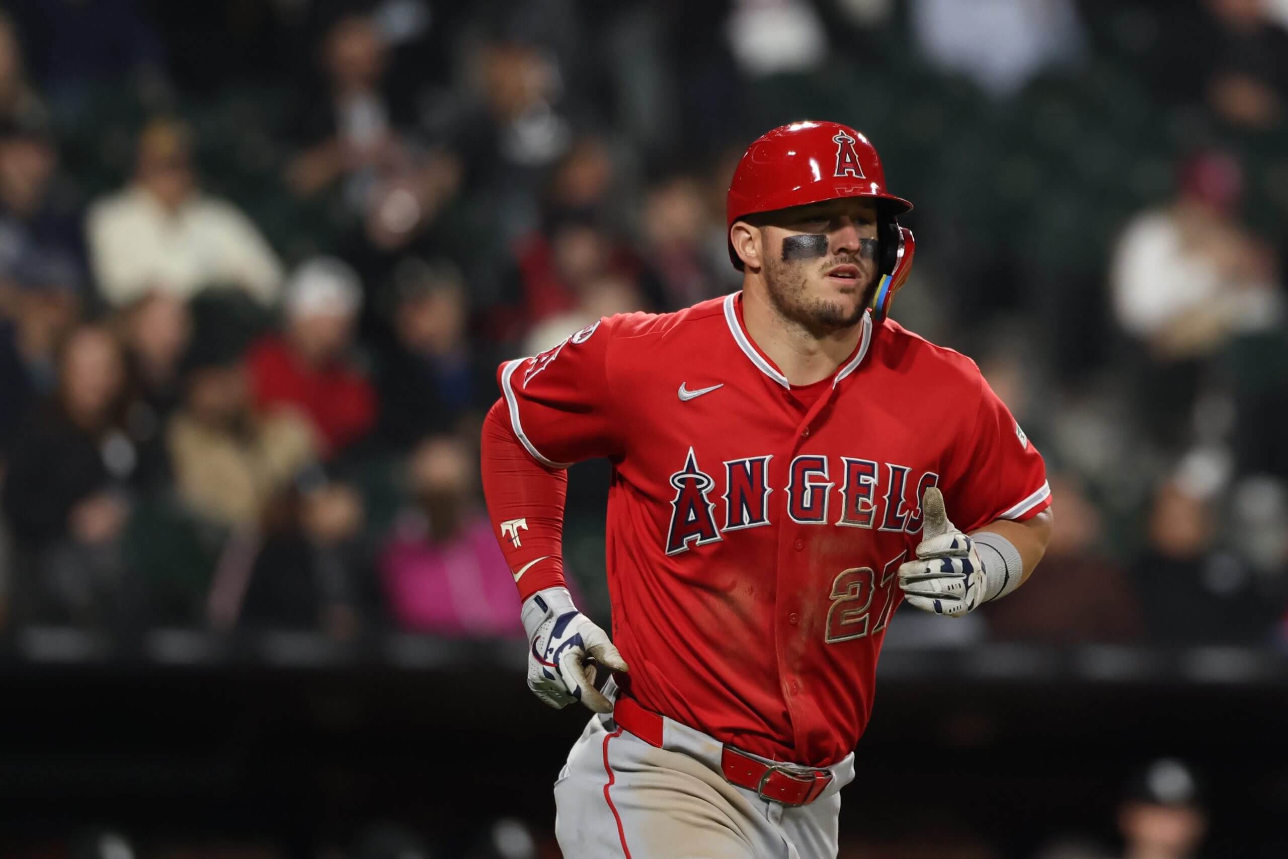 Mike Trout #27 of the Los Angeles Angels runs to first base during the ninth inning against the Chicago White Sox at Rate Field on April 28, 2026 in Chicago, Illinois.