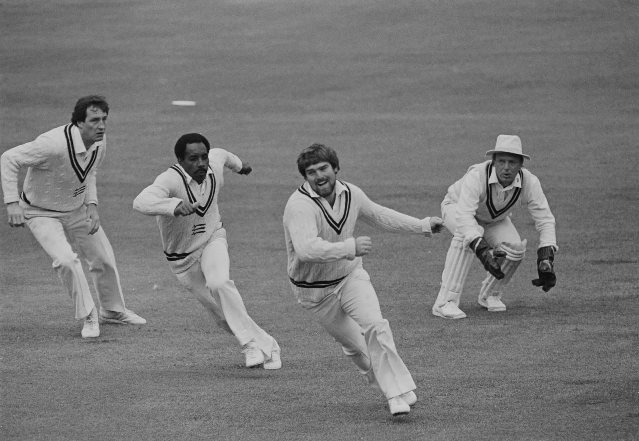 John Emburey, Roland Butcher, Mike Gatting and Paul Downton watch the ball sale through the slip cordon
