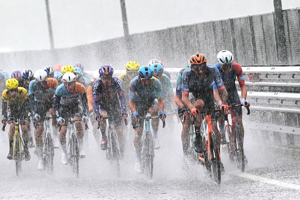 A general view of the peloton competing the peloton competing while it is raining heavily during the 109th Giro d'Italia