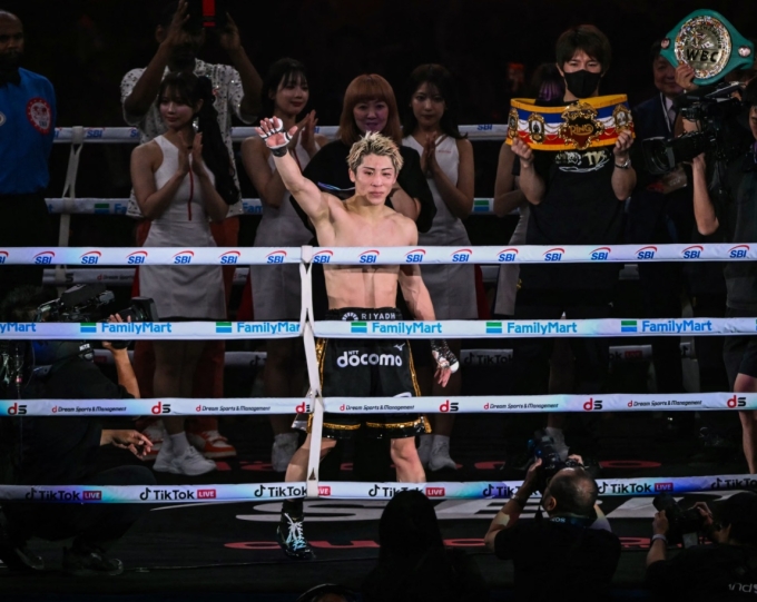 Naoya Inoue (C) celebrates after defeating Junto Nakatani in their super bantamweight championship boxing contest at Tokyo Dome in Tokyo on May 2, 2026. Photo by AFP
