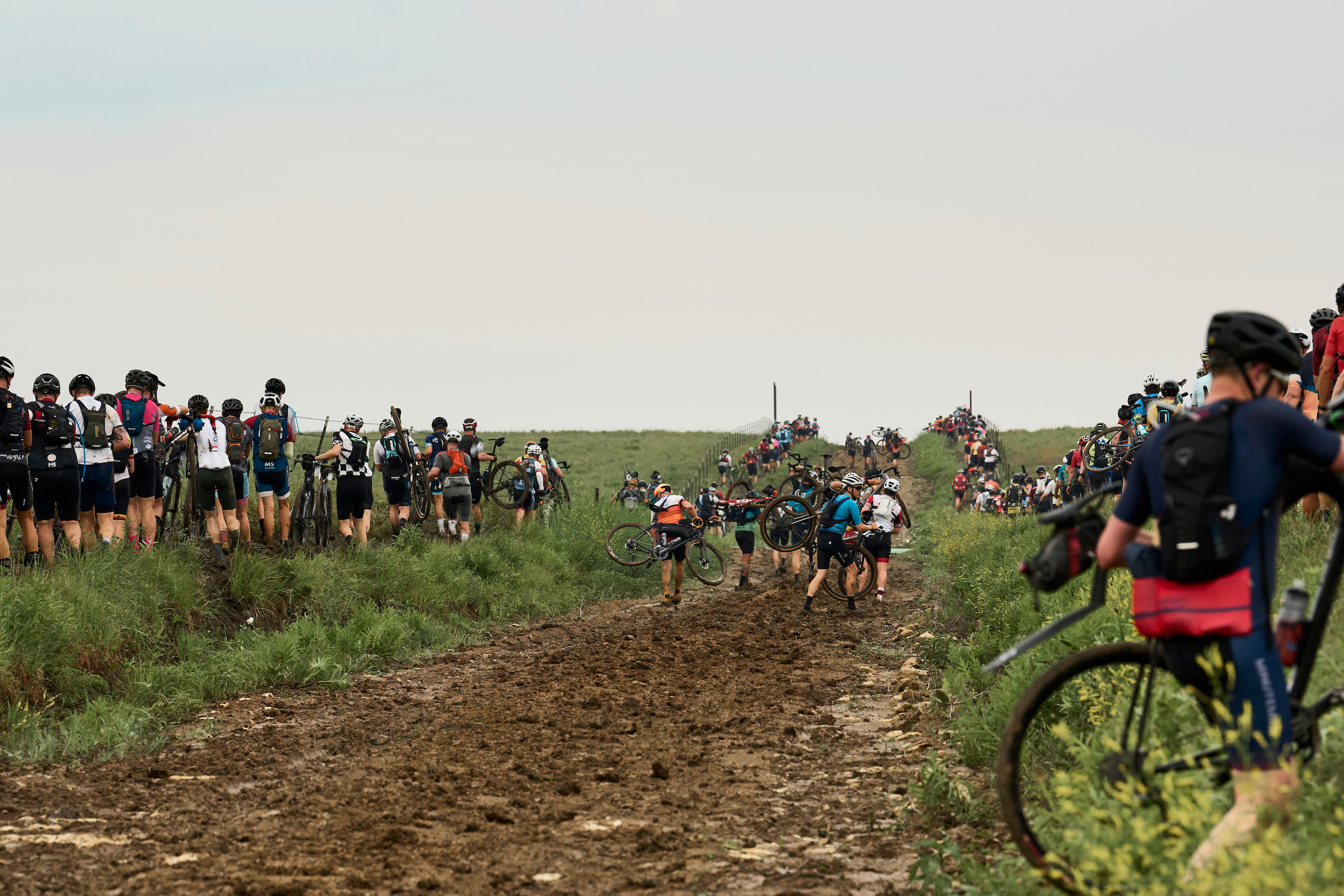 Mud caused riders to dismount bikes at D Hill just 10 miles into Unbound Gravel 200 and Unbound Gravel 100