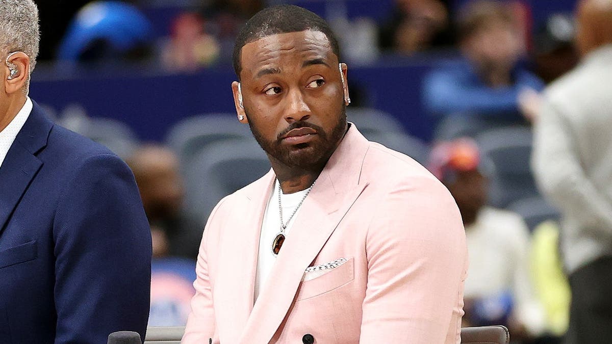 Former Washington Wizards guard John Wall looks on before a game at Capital One Arena.