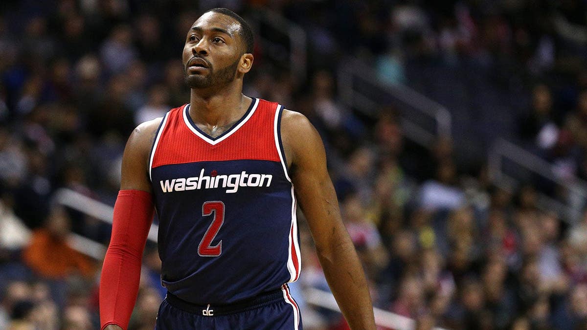 John Wall looking on during a Washington Wizards game