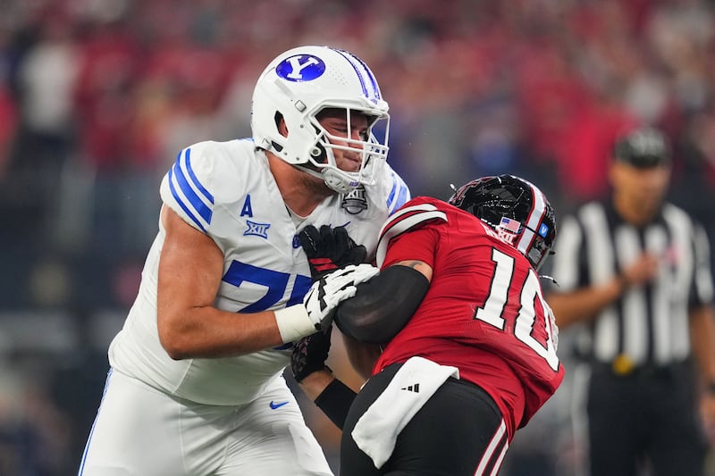 BYU offensive lineman Andrew Gentry (75) blocks Texas Tech safety Cole Wisniewski (5) during Big 12 championship game Saturday, Dec. 6, 2025, in Arlington, Texas.