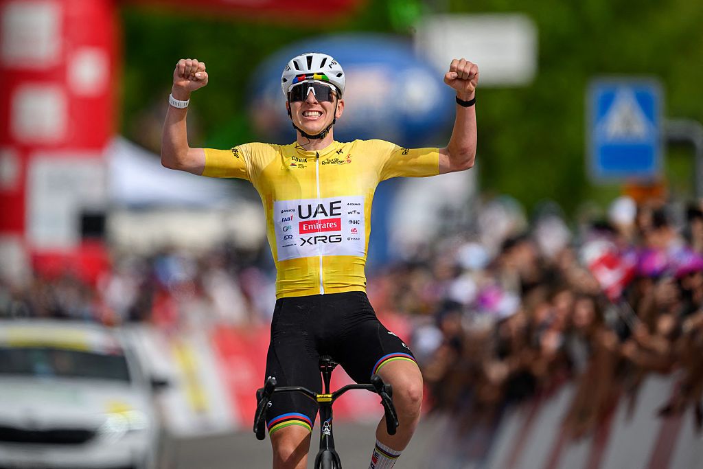 UAE Team Emirates-XRG's Slovenian rider Tadej Pogacar celebrates as he crosses the finish line wining the fourth stage of the Tour of Romandie UCI cycling World tour, 149.6 km from Broc and to Charmey, in Charmey, Switzerland, on May, 2, 2026. (Photo by Fabrice COFFRINI / AFP)