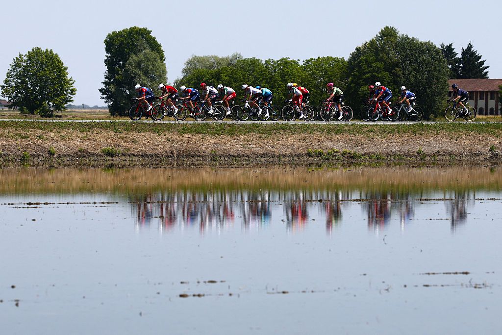 The pack rides during the 13th stage of the Giro d'Italia 2026 - Tour of Italy cycling race between Alessandria and Verbania, Italy, on May 22, 2026. (Photo by Luca Bettini / AFP)