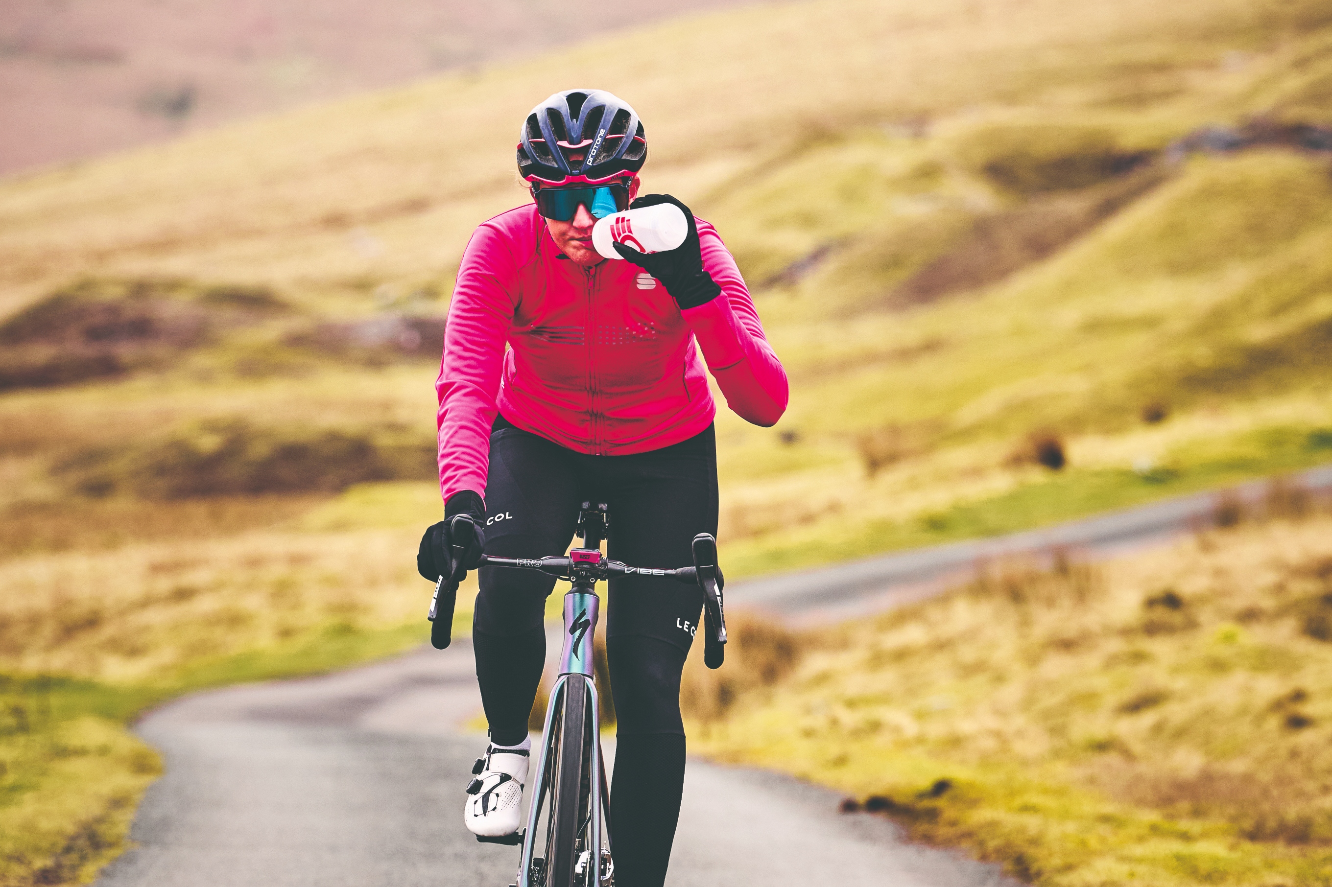rider drinking on the bike