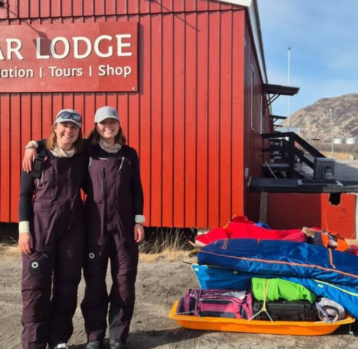 Norwegian adventurers Live Skattum and Marta Flotve standing next to their sleds in Greenland ready to start a West to East crossing.
