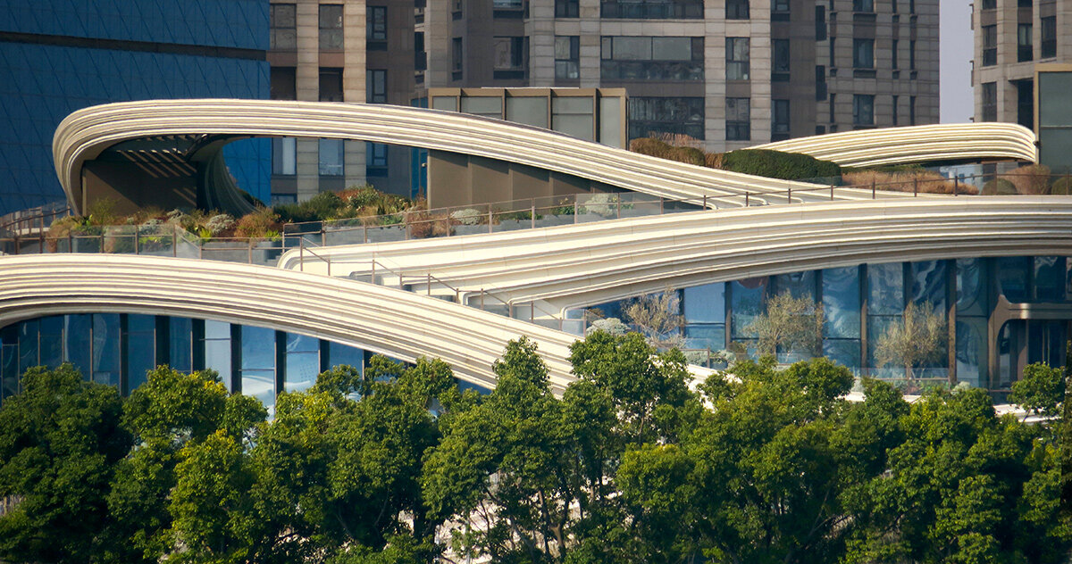 heatherwick’s moon bridge-inspired 'orbit' captured by paul clemence