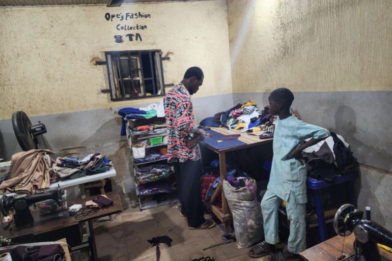 Opeyemi in his shop working