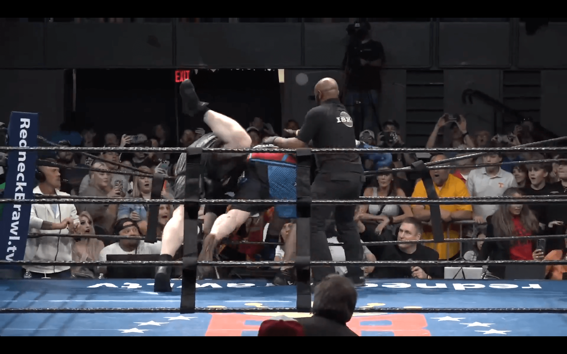 And Sasquatch goes over the far side ropes against Big R!