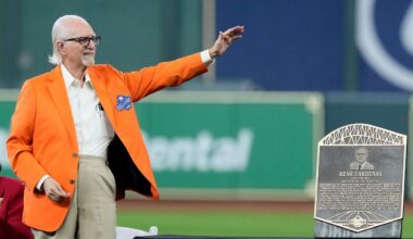 Longtime Spanish radio broadcaster René Cárdenas waves to the crowd as he is inducted into the Houston Astros Hall of Fame Saturday, Aug. 17, 2024, in Houston. (AP Photo/Kevin M. Cox, File)