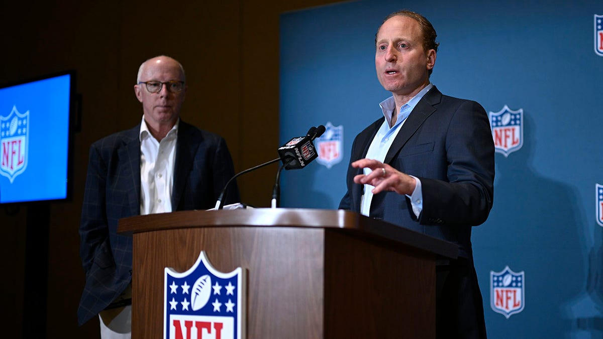 Rich McKay and Jeff Miller speaking at NFL owners meetings in Orlando