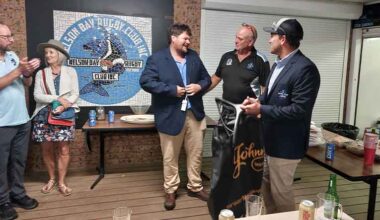 Nelson Bay rugby prop Nathan McLeay receives his 100th senior games jacket from club president Gavin Rocher.