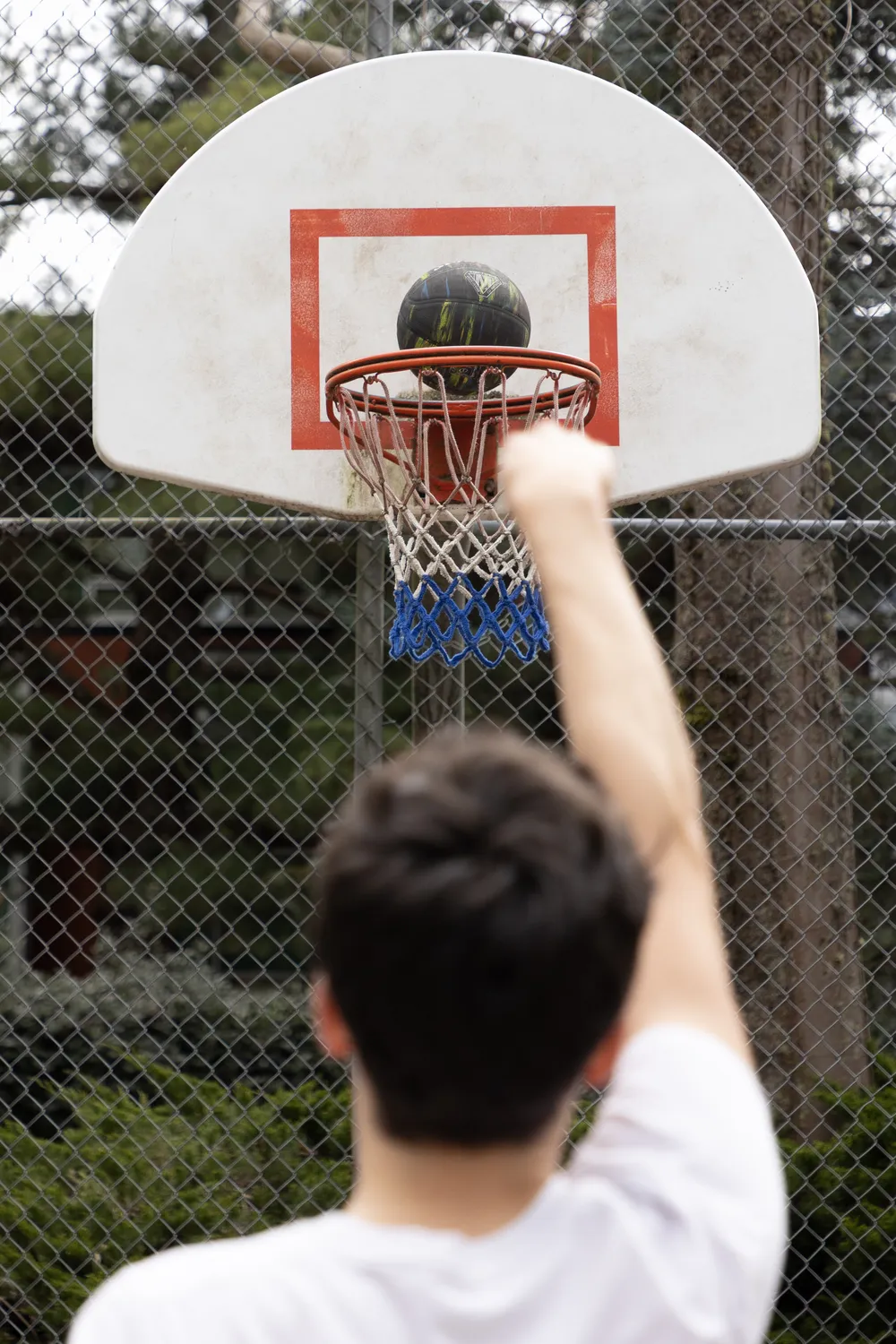 Ian shoots from free throw distance.