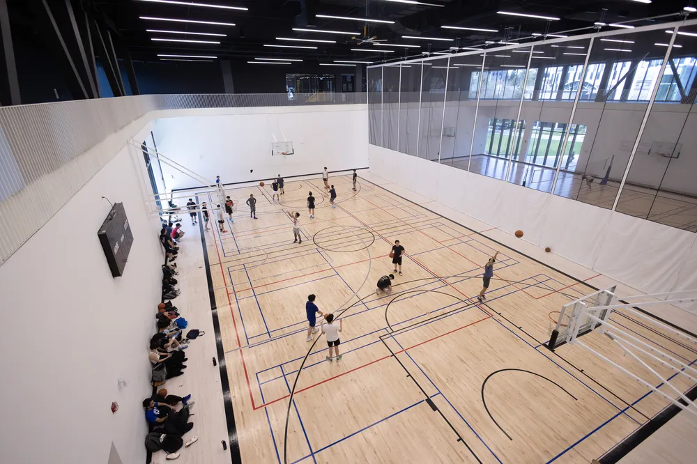 A top-down shot of the courts at Rec North during drop-in basketball hours.