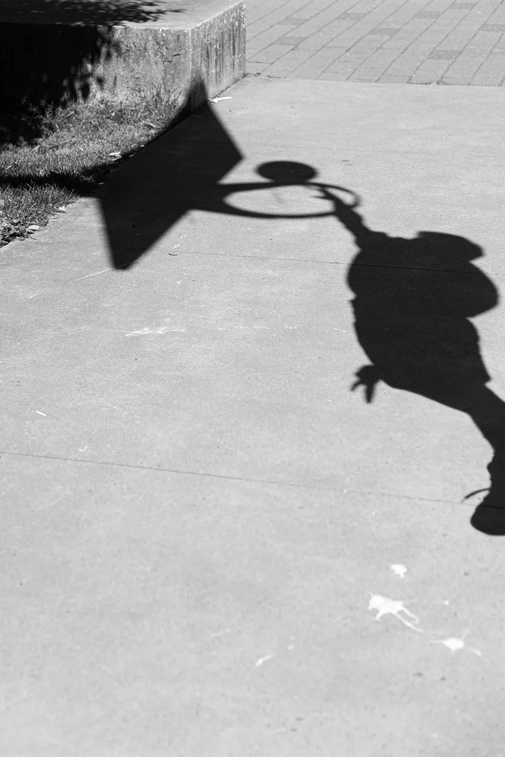 The shadow of Ian going for a dunk.