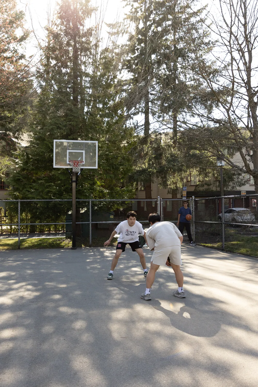 Ian guards somebody attempting to break to the net.