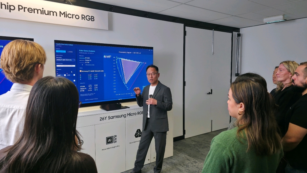 Samsung demonstrates the 75-inch Micro RGB TV (R95H) during a side-by-side picture quality comparison.
