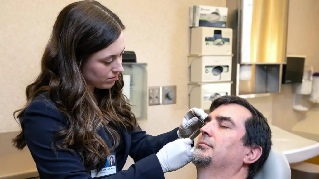 Sara Hutchinson, nurse practitioner, cares for a patient in the Plastic Surgery Cleft and Craniofacial Clinic at Mayo Clinic in Rochester.