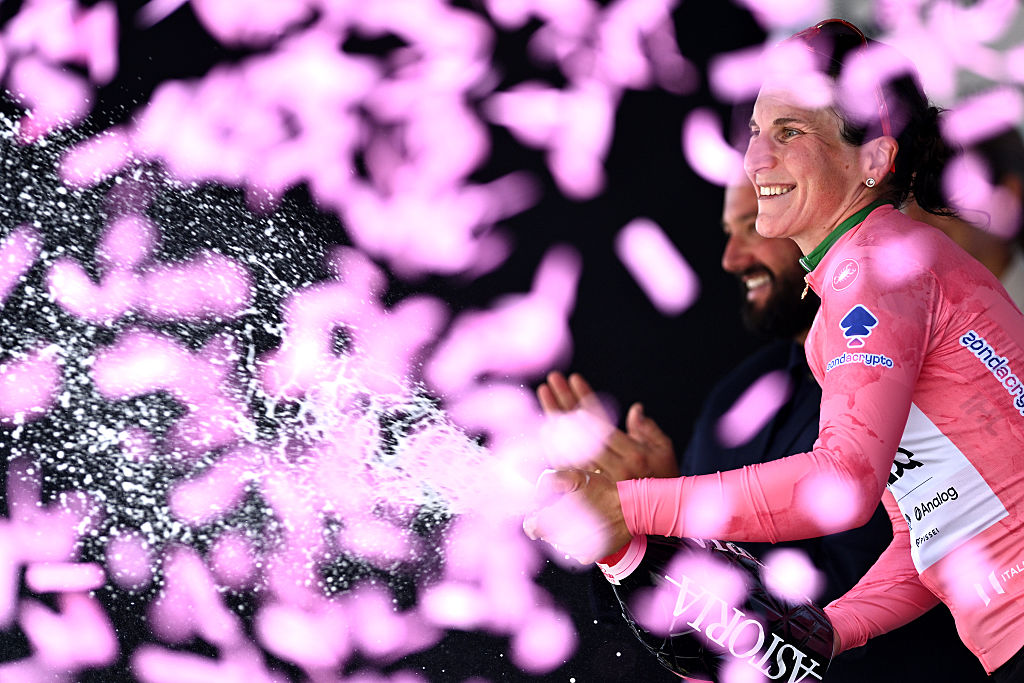 MONTE NERONE, ITALY - JULY 12: Elisa Longo Borghini of Italy and UAE Team ADQ celebrates at podium as Pink Leader Jersey winner during the 36th Giro d'Italia Women 2025, Stage 7 a 150km stage from Fermignano to Monte Nerone 1396m / #UCIWWT / on July 12, 2025 in Monte Nerone, Italy. (Photo by Luc Claessen/Getty Images)