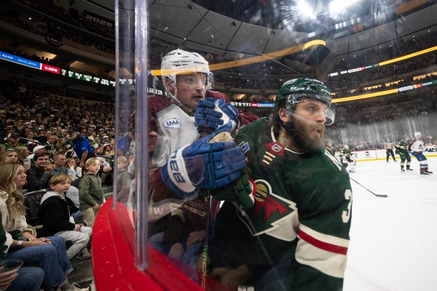 Defenseman Cale Makar (8) of the Colorado Avalanche and right wing Ryan Hartman (38) of the Minnesota Wild look as the play moves down-ice during the second period of Game 3 of the second round of the Stanley Cup Playoffs on Saturday, May 9, 2026, at Grand Casino Arena in St. Paul, Minn. (Photo by Timothy Hurst/The Denver Post)