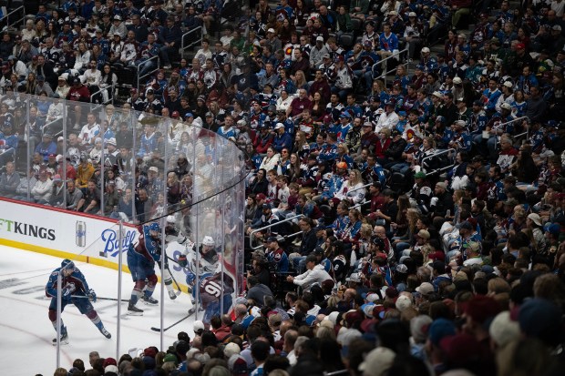 Fans look on while players fight for the puck during the second period of Game 5 of the second round of the Stanley Cup Playoffs between the Colorado Avalanche and the Minnesota Wild on Wednesday, May 13, 2026, at Ball Arena in Denver. (Photo by Timothy Hurst/The Denver Post)