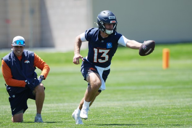 Denver Broncos quarterback E.J. Warner takes part in drills at the NFL football team's rookie minicamp Saturday, May 9, 2026, at the team's headquarters in Centennial, Colo. (AP Photo/David Zalubowski)