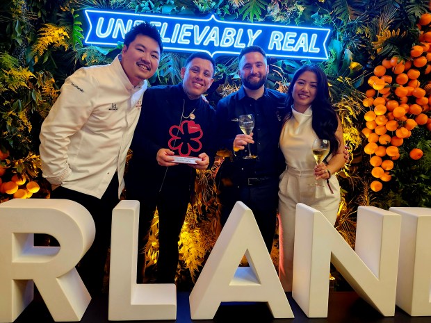 Posing post-wins: Executive chef/owner William Shen, Director of Mixology, Josue Villacis, General Manager Austin Joseph and Head of Hospitality Tracy Tran celebrate Sorekara. The restaurant received two Michelin stars at this year's awards ceremony. Joseph received the Special Award for Outstanding Service. (Amy Drew Thompson/Orlando Sentinel)