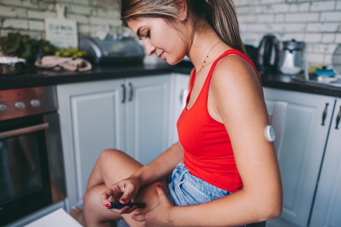Teenage girl with type 1 diabetes injecting insulin, daily diabetes care