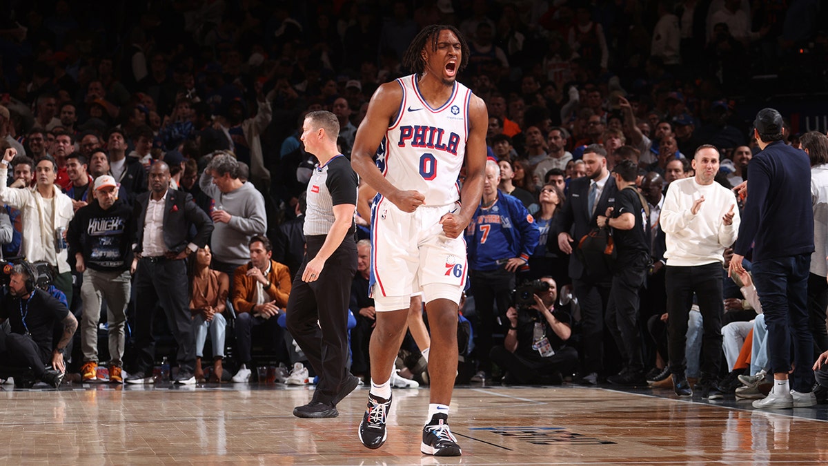 Tyrese Maxey of the Philadelphia 76ers celebrating on the basketball court