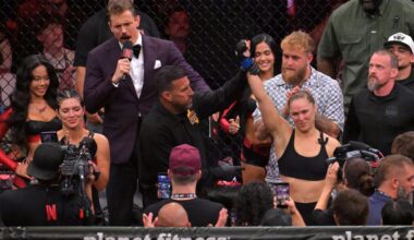 May 16, 2026; Los Angeles, California, USA; Ronda Rousey (blue gloves) celebrates defeating Gina Carano (red gloves) after a women's featherweight bout at Intuit Dome. Mandatory Credit: Jayne Kamin-Oncea-Imagn Images