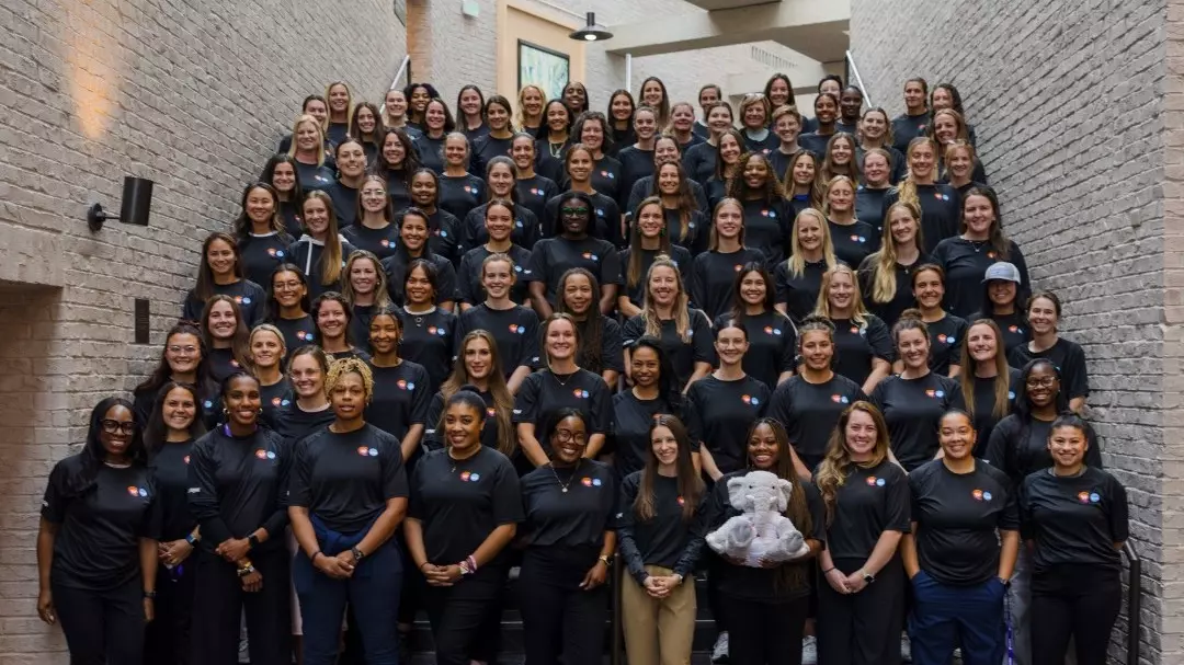 Photo of a group of women coaches lined up on stairs at NCAA Womens Coaches Academy Class #56