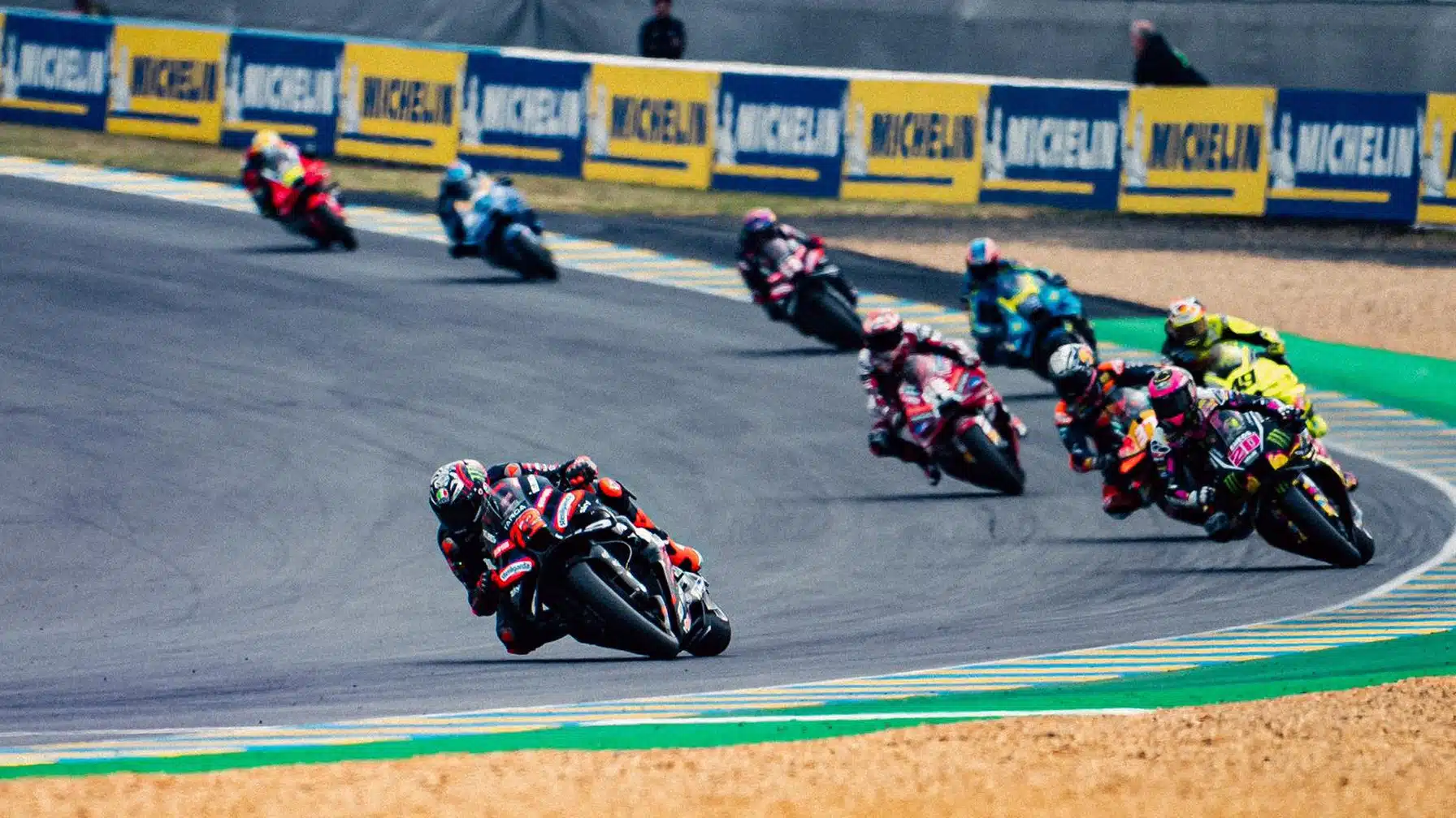 Bezzecchi leads through Turn 1, Martin is about to start moving forward from seventh