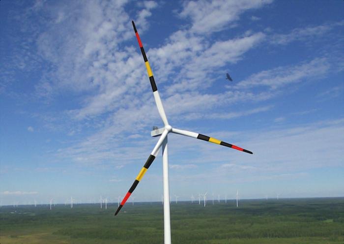 A drone photograph of a wind turbine in southern Finland, digitally modified with a biologically inspired warning pattern under natural light conditions. Credit: Eric Lehtonen