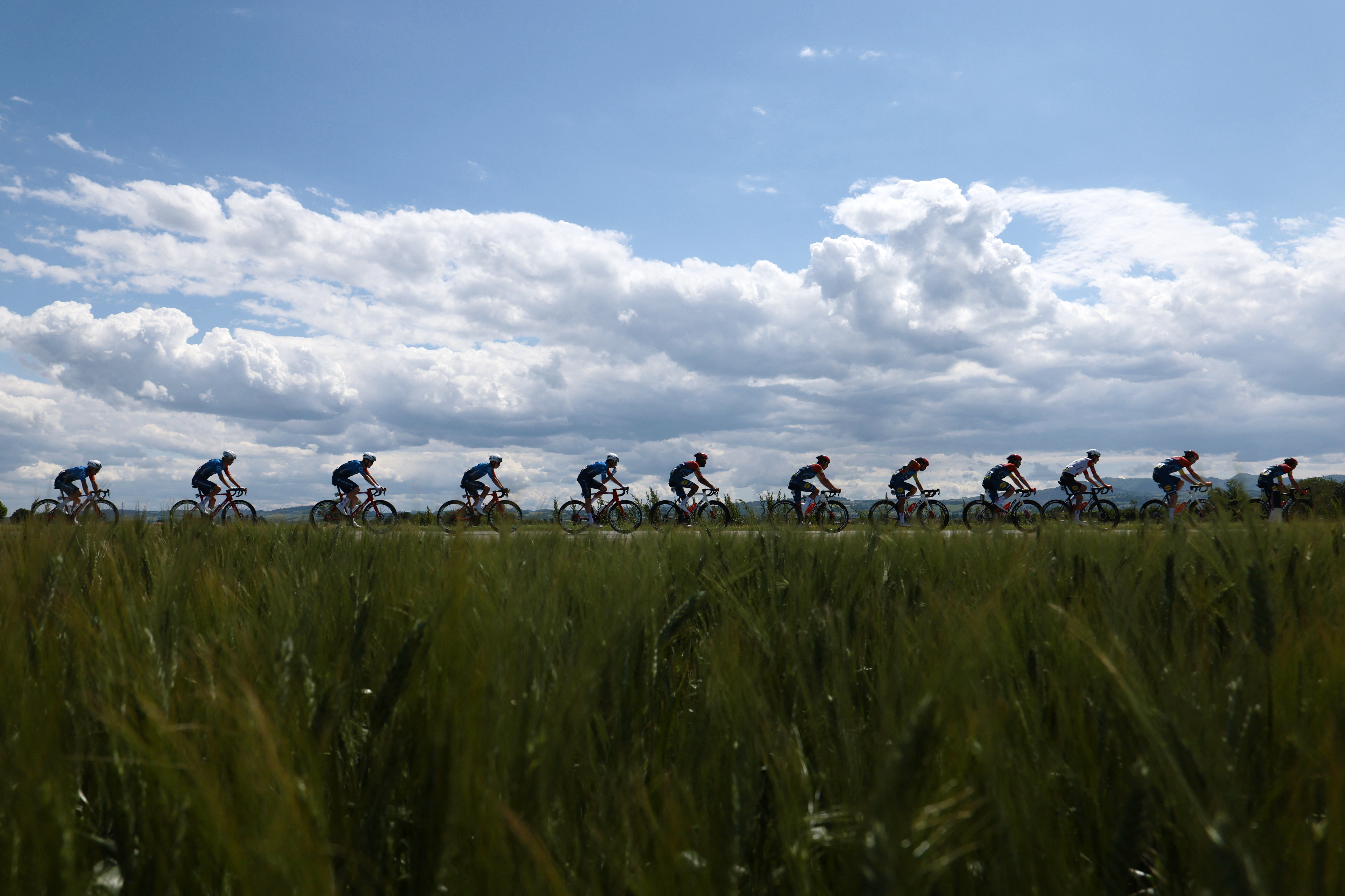Competitors ride during the 9th stage of the Giro d'Italia 2026 - Tour of Italy cycling race between Cervia and Corno alle Scale, central Italy on May 17, 2026. (Photo by Luca Bettini / AFP)