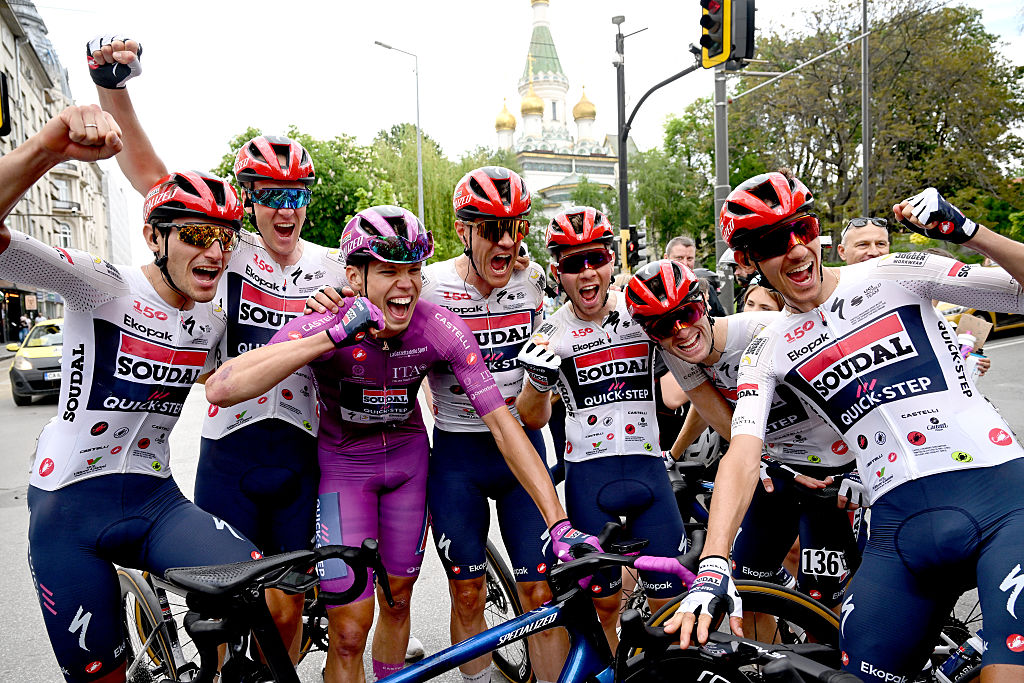 SOFIA, BULGARIA - MAY 10: Stage winner Paul Magnier of France and Team Soudal Quick-Step - Purple Points Jersey celebrates the victory of with his teammates Ayco Bastiaens of Belgium, Gianmarco Garofoli of Italy, Andrea Raccagni Noviero of Italy, Jasper Stuyven of Belgium, Fabio Van den Bossche of Belgium, Dries Van Gestel of Belgium, Filippo Zana of Italy after the 109th Giro d&amp;apos;Italia 2026, Stage 3 a 175km stage from Plovdiv to Sofia / #UCIWT / on May 10, 2026 in Sofia, Bulgaria. (Photo by Dario Belingheri/Getty Images)