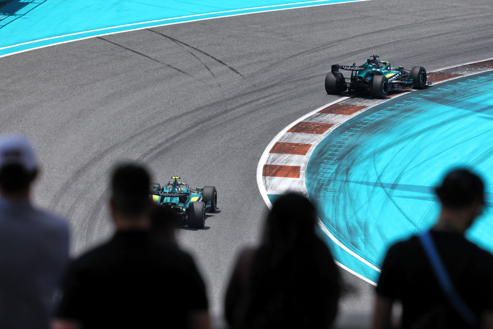 Fans watch Fernando Alonso and Lance Stroll on track during the Miami Grand Prix.