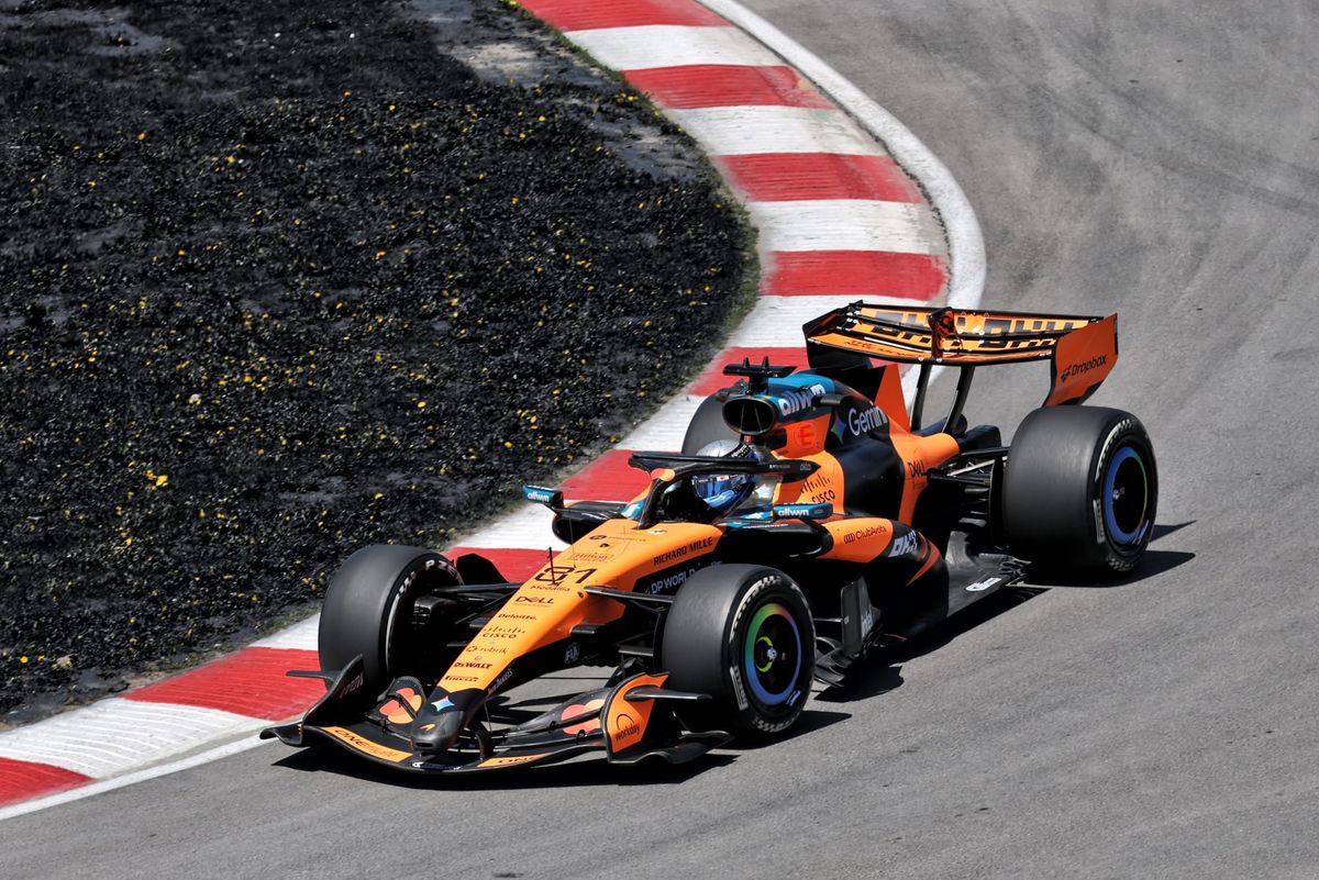 Gary Anderson on the front wing McLaren had to remove