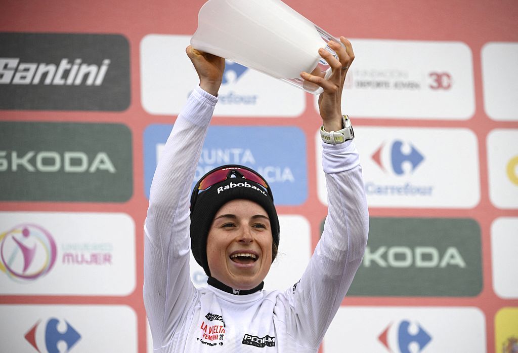 Third placed of 2026 La Vuelta Femenina cycling tour of Spain, team Team Visma - Lease a Bike's French rider Marion Bunel celebrates on the podium after the 7th stage, a 132.9 km race between Pola de Laviana and Alto de l'Angliru, on May 9, 2026. (Photo by Miguel RIOPA / AFP via Getty Images)