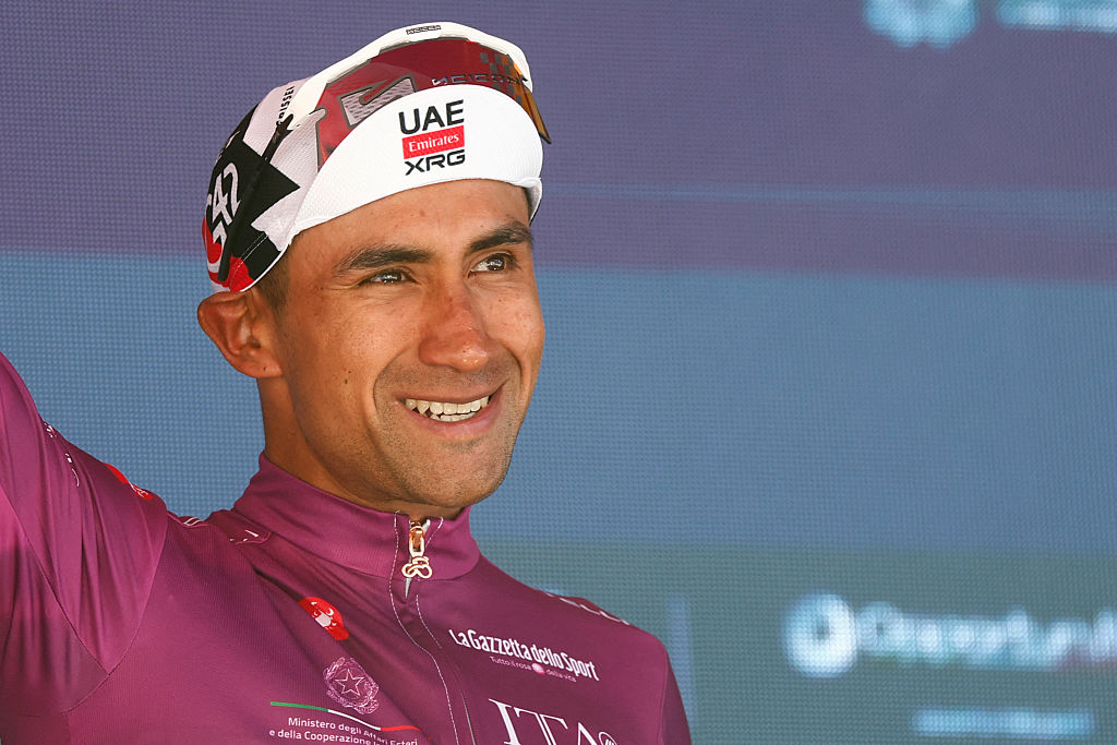 UAE Team Emirates - XRG Ecuadorian rider Jhonatan Narvaez poses with the best sprinter's cyclamen jersey on the podium of the 14th stage of the Giro d'Italia 2026 - Tour of Italy cycling race between Aosta and Pila (Gressan), Italy, on May 23, 2026. (Photo by Luca Bettini / AFP)