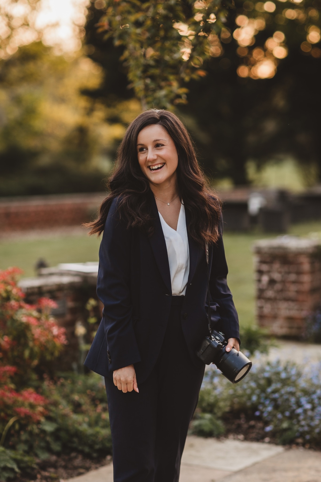 A long profile shot of wedding photographer Alisa Roberts at sunset