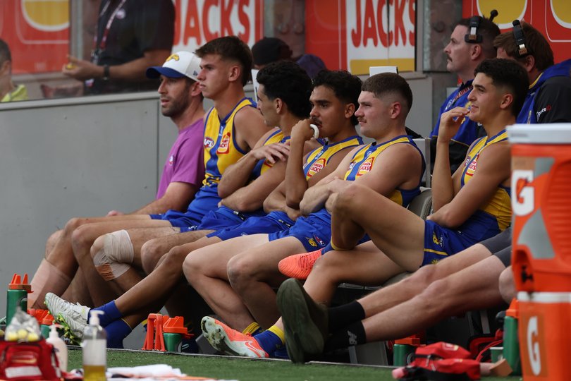West Coast players watch on from the bench as they lose to Richmond.
