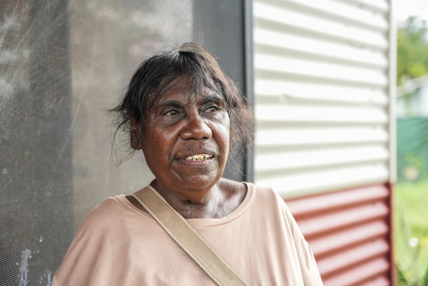 An Aboriginal woman facing camera and looking away