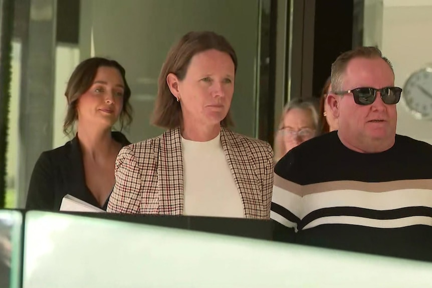 Gailene Hamilton walking outside court.