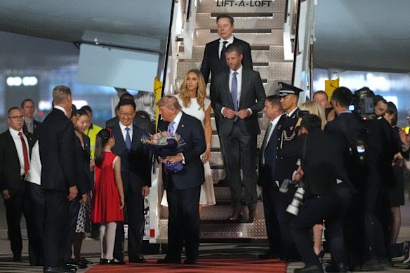 

President Donald Trump is greeted by China’s Vice President Han Zheng as he arrives on Air Force One at Beijing Capital International Airport in Beijing. 